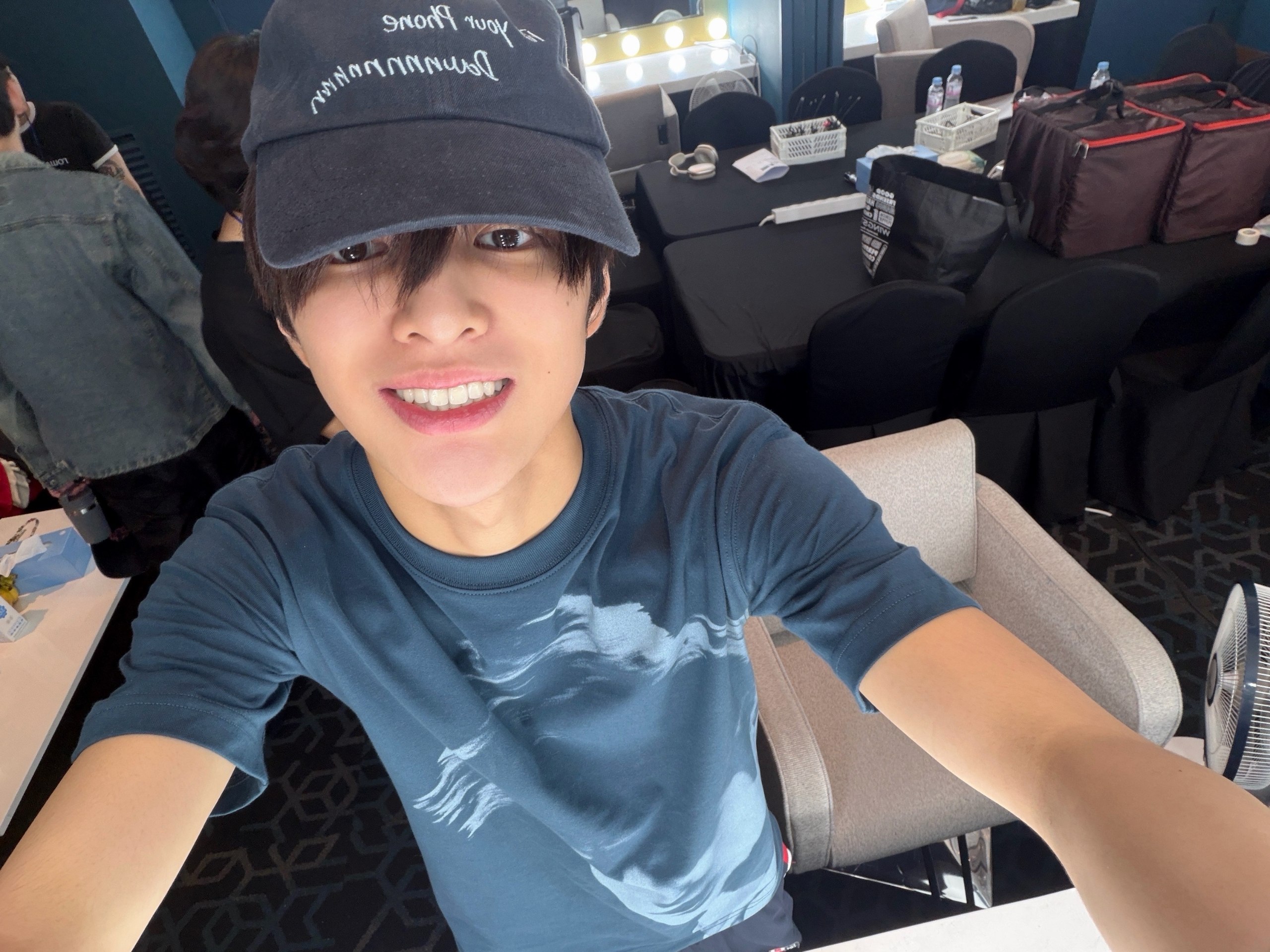 Bright backstage smile in cap